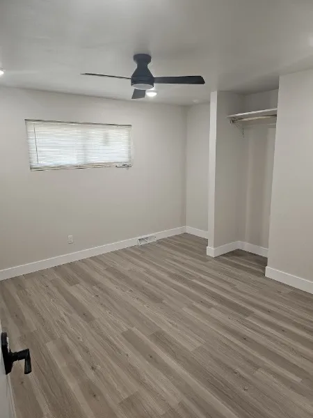 Clean private bedroom, fresh paint and wood flooring